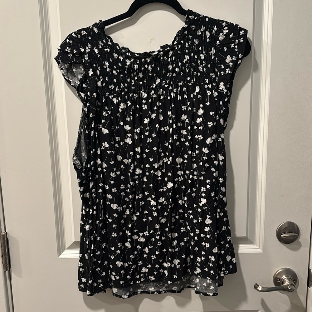 Sleeveless top with smocked top